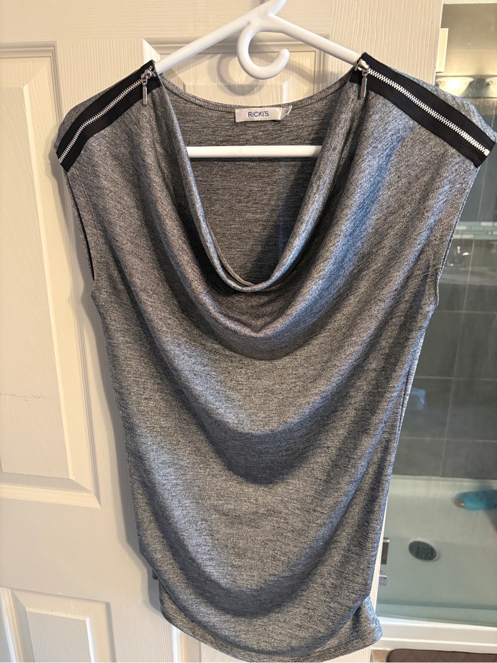 Silver cowl neck shirt.